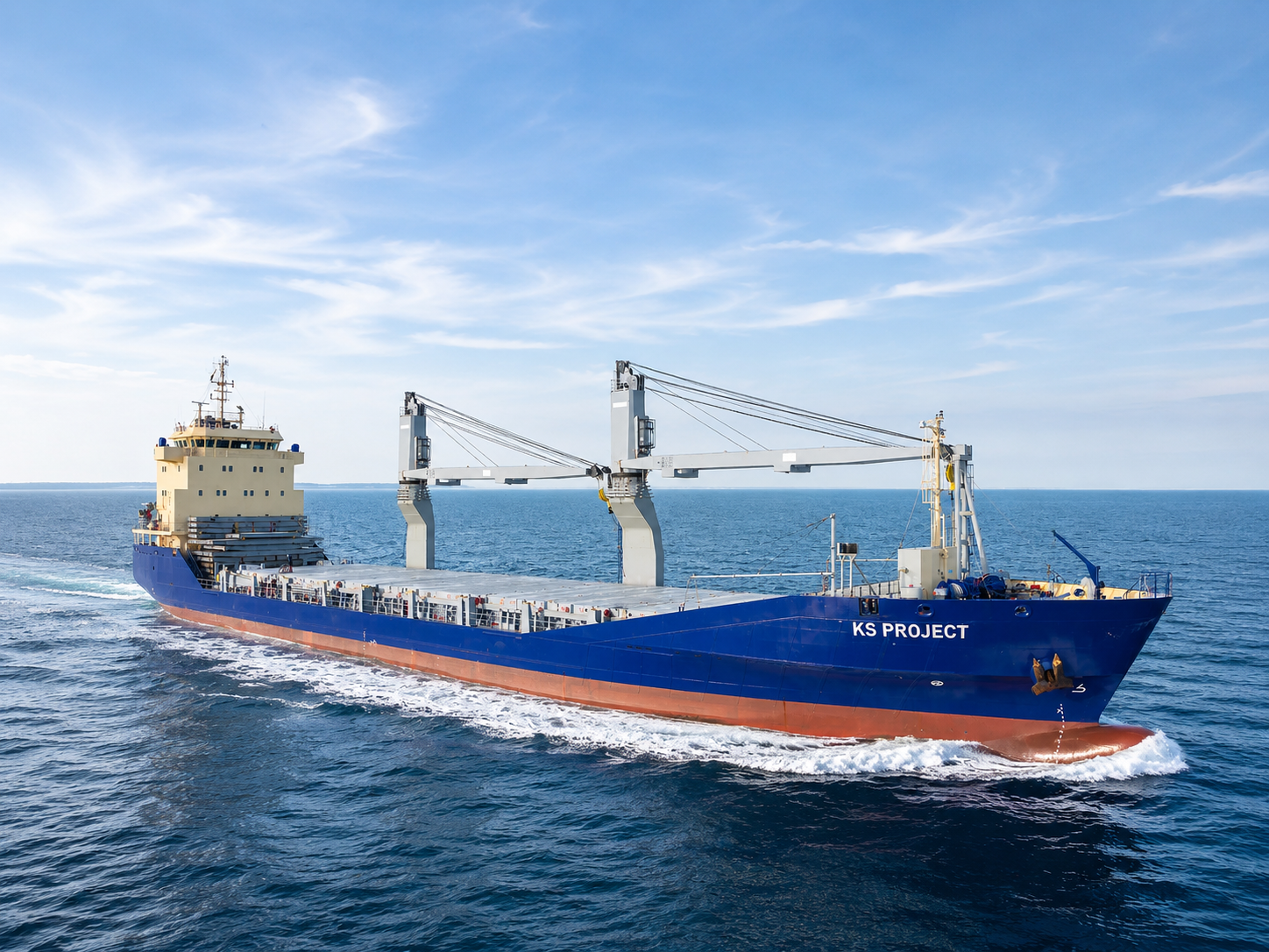 Geared multipurpose vessel KS PROJECT under way in open water, deck cranes raised and project cargo deck fittings visible.