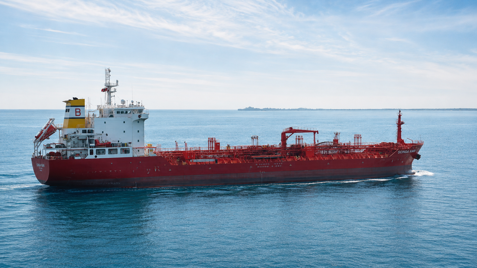 Chemical tanker SONGA KARI under way in open water, deck piping and midship crane visible.